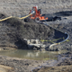 In this Jan. 14, 2016 file photo, a drainage pipe that was the original culprit of a coal ash spill that was one of the worst in U.S. history is seen at the Dan River Steam Station in Eden, N.C.